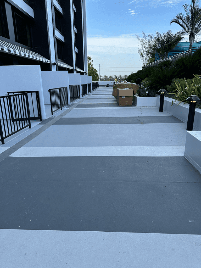 Pool Side Entryway Path Long - After MACoat A view of the entire length of the pool deck completed entryway path