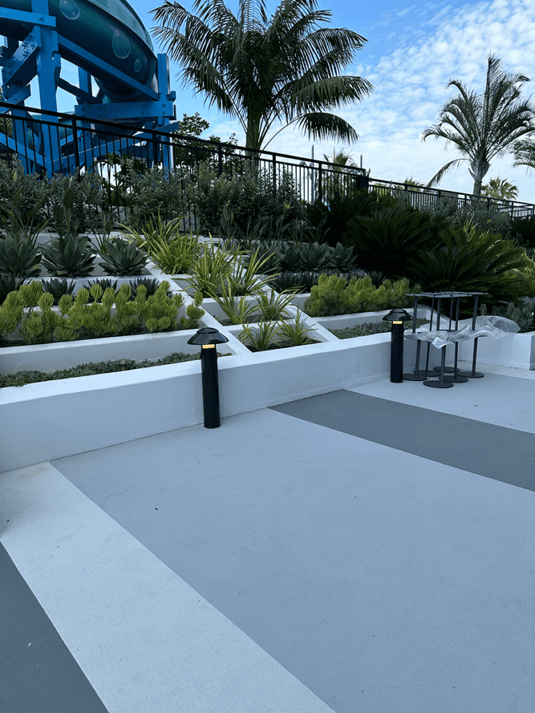 Pool Side Entryway Path - After MACoat Pool deck sloped garden walls and finished path