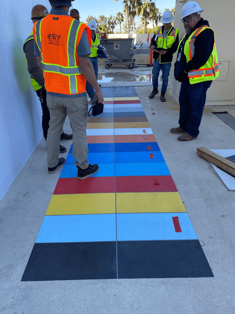 Pixar Place Color Mock Up MACoat Applicators lay out the multiple topcoat colors that will be used for the job.