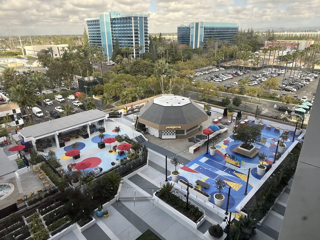 Pixar Place Sky View 2 MACoat A top-down view of the finished pool deck areas