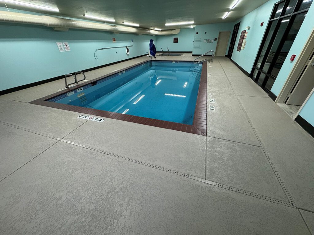 evergreen-3-reduced-texture-crete Looking across the indoor pool room